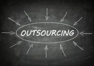 arrows pointing towards the word outsourcing