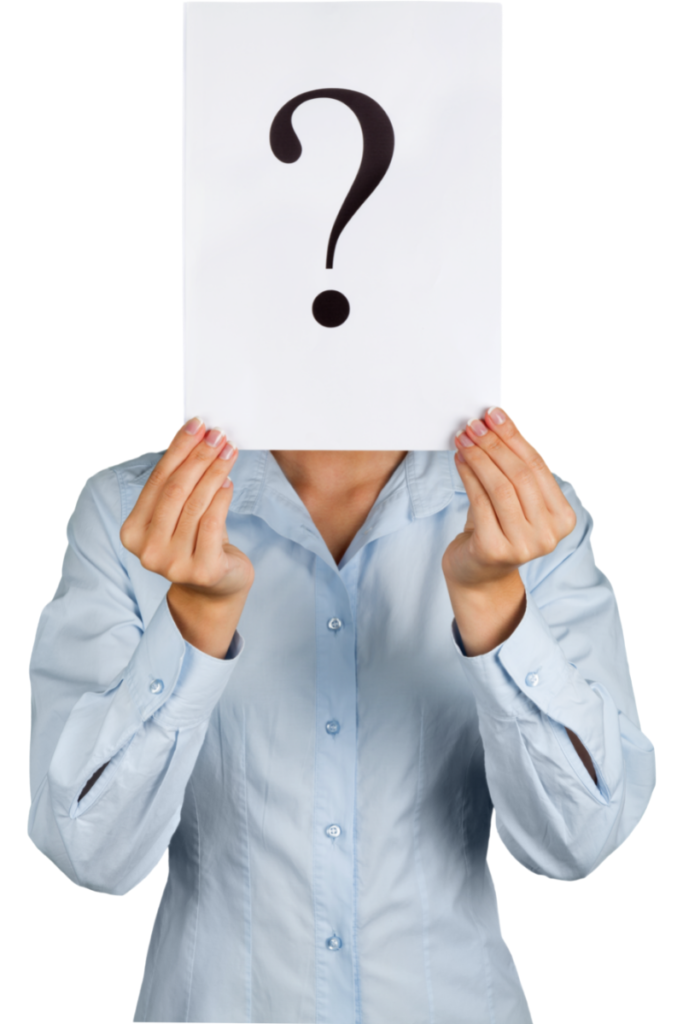 woman holding up paper with question mark on it
